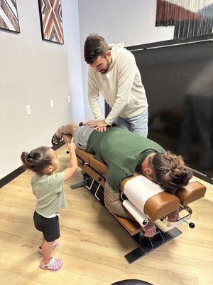 My husband and youngest getting adjusted