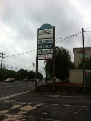 Sign in front alongside road