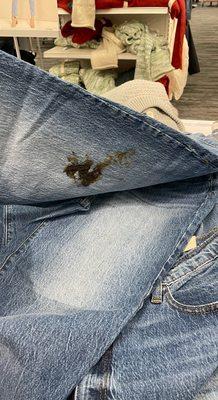 poop on the jeans on the display table