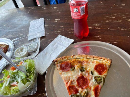 Pepperoni jalapeño pizza slice, garden salad and Big Red