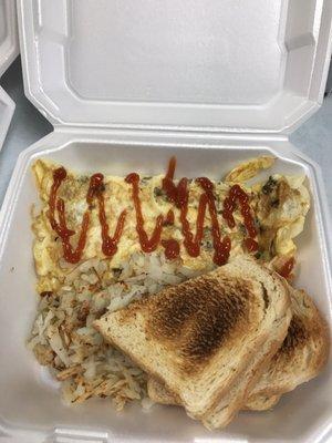 Vegetable omelette with hash browns and sour dough bread.