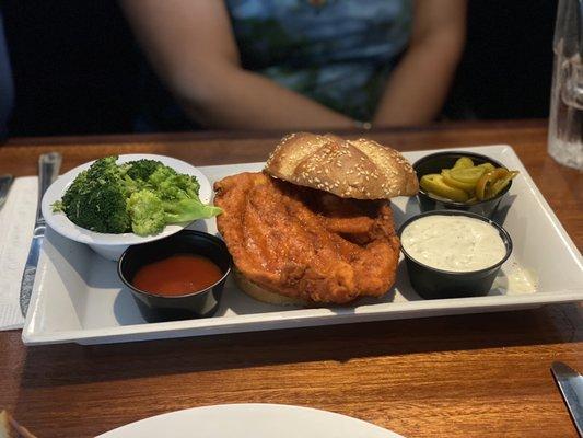 Fried Buffalo chicken sandwich with broccoli