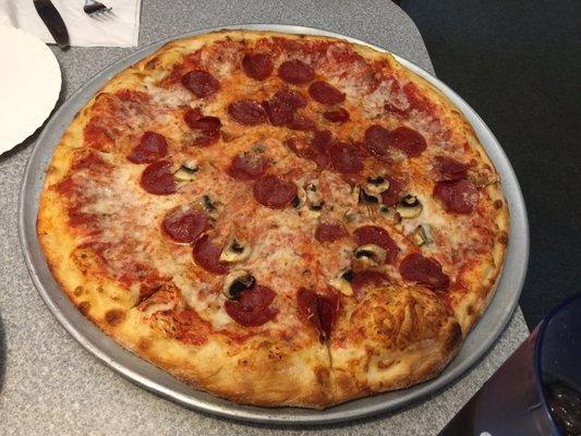 Pepperoni pizza with mushrooms on half