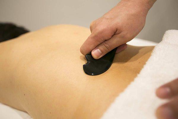 Gua-Sha is a treatment in which the skin is pressed and scraped which can heal more than just muscle pain and stiffness.