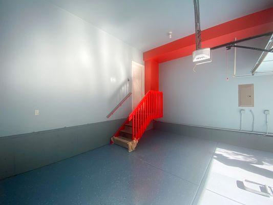 Revamped our garage interior! Behold the bold blue walls, soaring ceilings, and a striking red accent that pops!  #GarageUpgrade #Colorfu