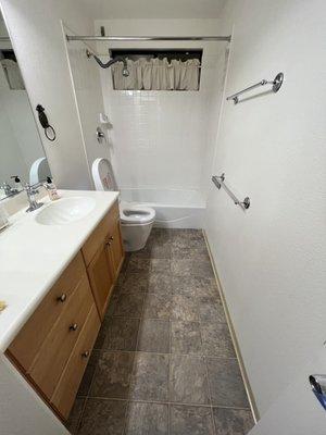 Original linoleum flooring, tiled walls and bathtub. Came in on a Wednesday morning to demolish.