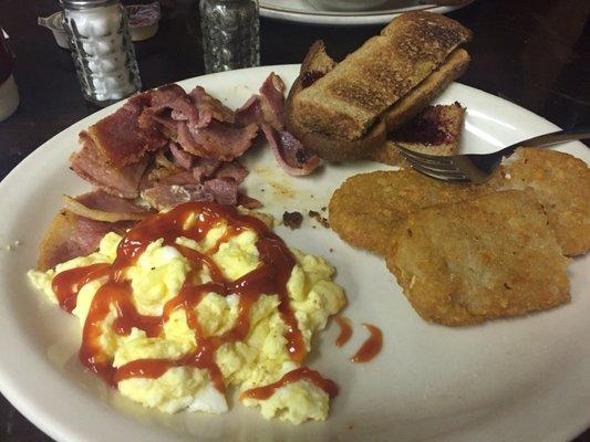 Country ham, scrambled eggs and hash browns.