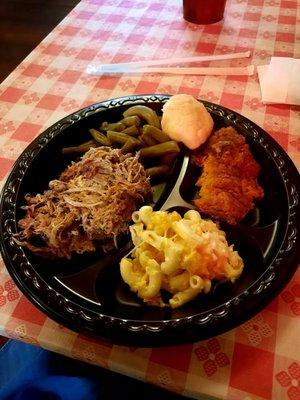 Well seasoned pulled pork, green beans, sweet potato casserole,  deliciuous Mac n cheese and bicuit.