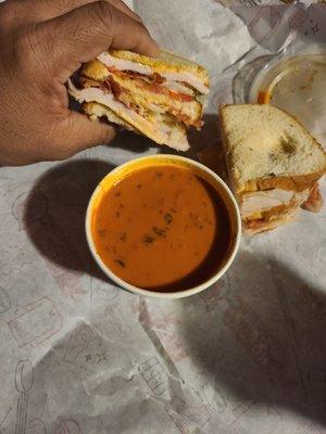 Spicy turkey sandwich and tomato basil soup to go