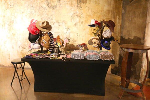 A picture of our Photo Booth prop table during 2019 at Ethan & Alysa's Wedding at the Bella Terre Reception Hall & Vineyard in Glenwood IA!