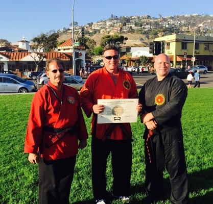 Promoted by 10th Degree black belt Master Armen Heroian on the left and 9th Degree black belt Master Robert Bombalier on the ...