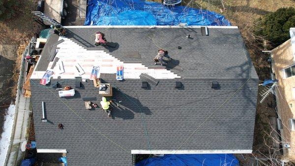 shingling almost complete, attic vents installed and working on chimney flashing