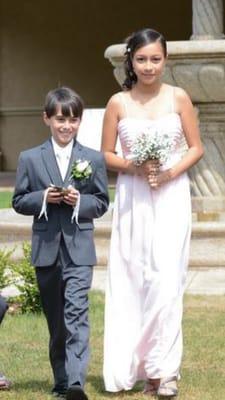 The jr bm with her bouquet and the ring bearer with his adorable boutteniere