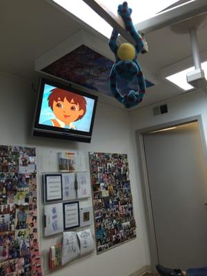 Cartoons, cool backlit pictures on the ceiling, and hanging stuffed animals. What more could a kid ask for at the dentist?