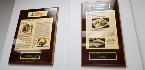 Plaques on the wall inside the shop