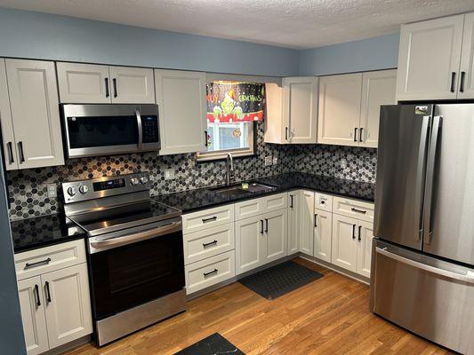 J&k all wood cabinetry with soft close ,topped off with beautiful Nero mystic quartz countertops & a stylish tile backsplash