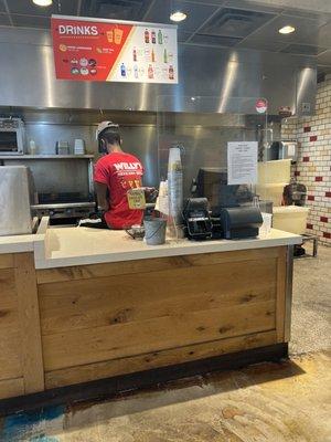 No clean tables to sit at and both workers sitting around on their phones.