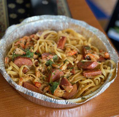 CRAWFISH PASTA, chunky crawfish meat, spicy sausage, house tomato cream marinara sauce