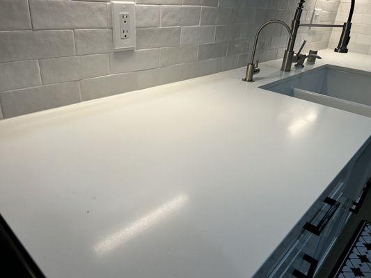 After image: ex of water stains removed from our "Arctic white" countertops (note dark specs pictures are part of the look; not stains).