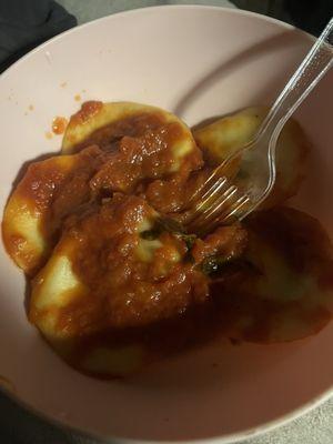 Spinach ravioli with their homemade tomato basil sauce