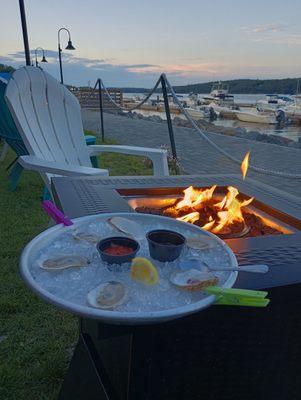 1/2 dozen oysters by the fire pit and the marina/river view!