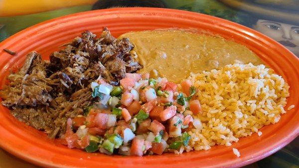 Carnitas, beans, rice and tortilla. This was delicious!!