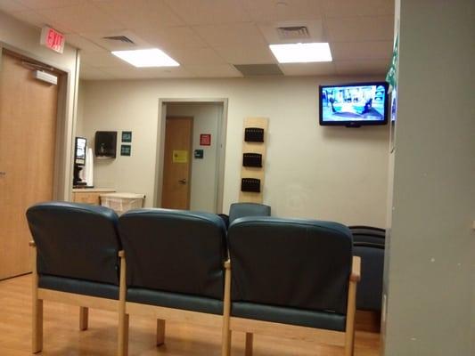 Surgical waiting room. It has bathrooms, a tv, and a coffee machine (free). No magazines and poor Wi-Fi.