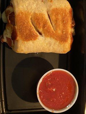 Pepperoni roll with some tasty sauce