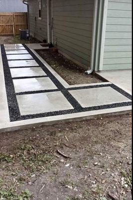 Square sidewalk going from side door to patio