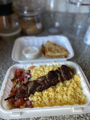 Beef Souvlaki (comes with rice and shepherd salad), pita & tzatziki extra.