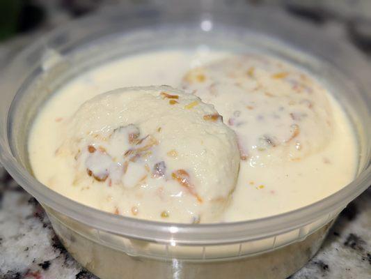 Rasmalai. Creamy and milky syrup with chhena ("cottage cheese") balls. Syrup ingredients: milk, sugar, cream, and saffron. $4.