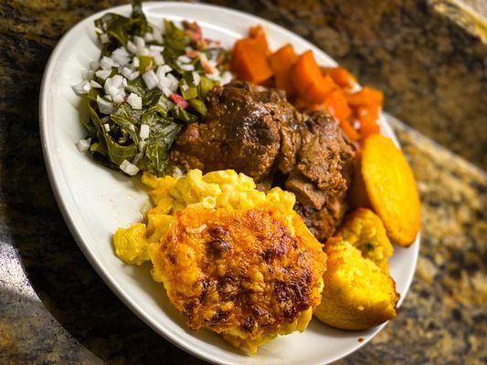 Neckbones, greens, candied yams, honey jalapeño cornbread muffins and Mac n cheese