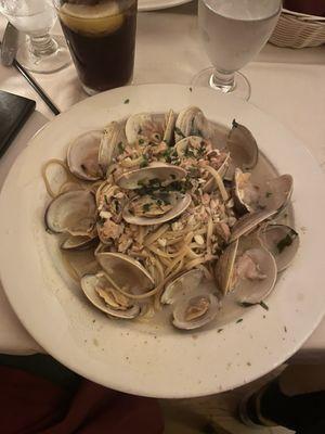 Linguine with clams and white sauce; he couldn't eat it all, but took it home with some of the bread sopping up that sauce.