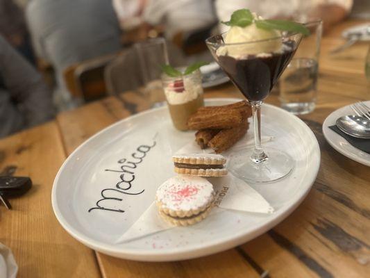 A dessert sampler with Alfajores, churros filled with Dulce de Leche... and a few other treats.