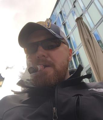 Enjoying a cigar while walking the streets of Germany.