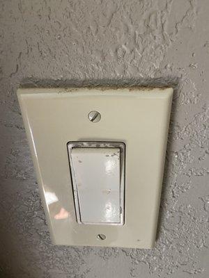 Dirt on light switch.