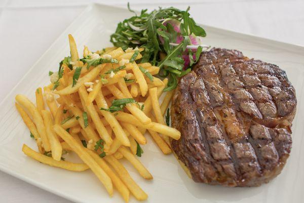 Black Pepper Ribeye  niman ranch 16oz. ribeye, garlic pepper sauce, garlic frites, arugula salad