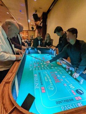 Our 8' regulation craps table fits into most spaces and can be "lit up" with our LED lightings for a more intimate setting.