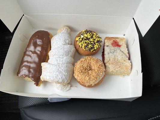 Custard-filled Long John, giant lady lock, toasted coconut, Steeler sprinkled cake donut, & cherry strudel.