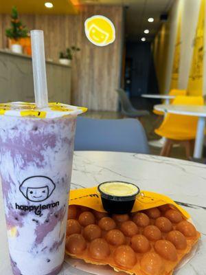 Ube black tea with taro ball, 2 crystal boba, and pudding with plain bubble waffle and puff cream. Yuuuuuummmm....