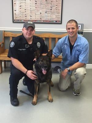 Dr. Chris Blevins with Officer Dale Robertson and K-9 Officer Roccon.