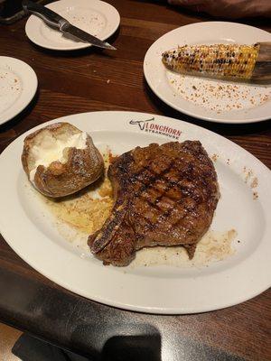 Cowboy ribeye, potato and right in the corner is the delicious corn