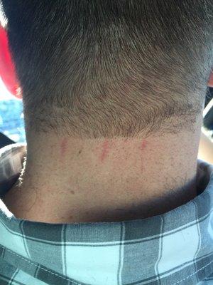 And this was the back of my husbands neck. She cut him too. Unacceptable.