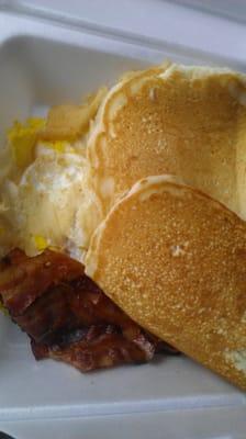 Three pancakes, two eggs and bacon.