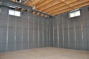 Basement to Beautiful panels provide basement wall insulation and waterproof steel framing in a single step.