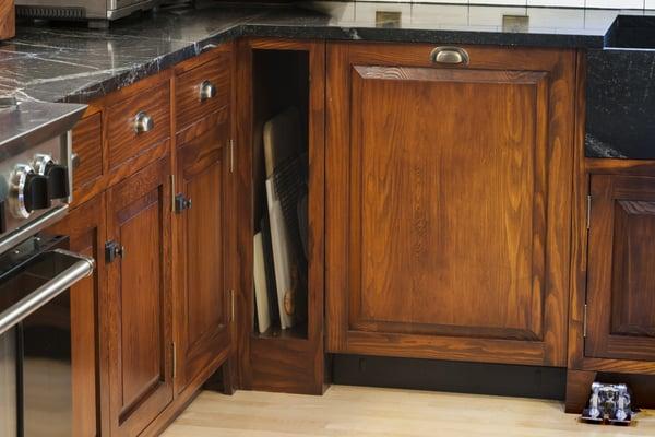 This small cabinet smartly uses a narrow space for cutting boards