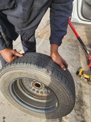 A tire with a patch in it.