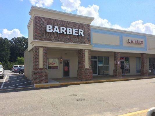 Barber Shop is towards the back of the shopping center, behind Virginia ABC store and Gamestop.