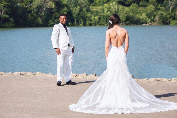 Bride and Groom posed at a lake after the Wedding