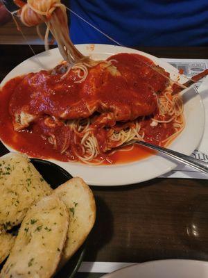 Veal parmesan with spaghetti.